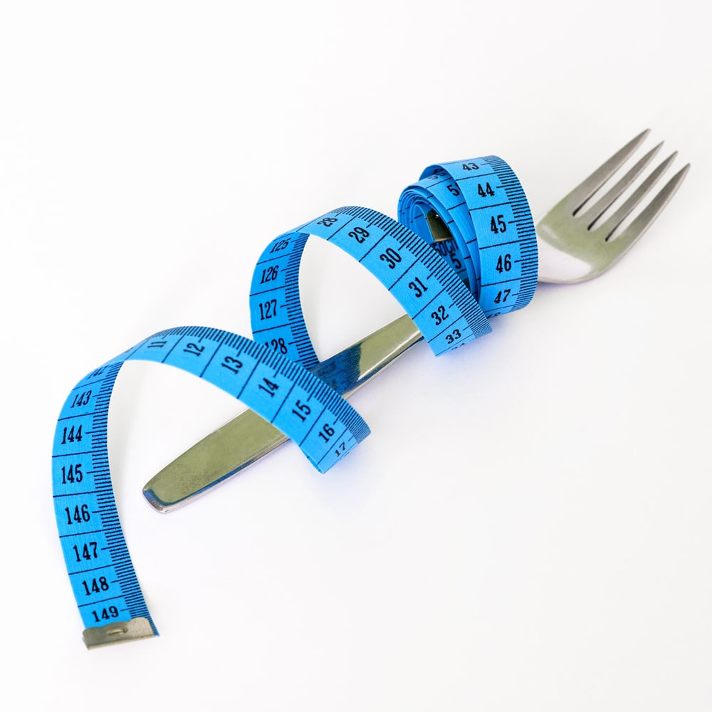 Übergewicht Maßband Ernährung.